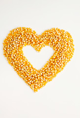 Corn kernels with heart shape inside.