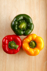 Red, green and yellow capsicums.