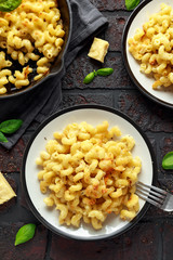 Homemade baked macaroni and cheese with cheddar served on plate