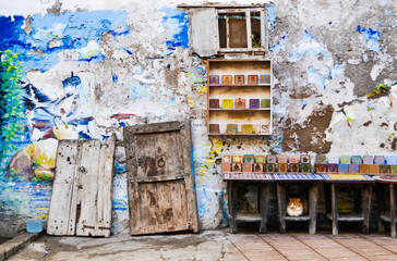 Blue washed out painted shop wall in Morocco