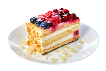 Forest fruit cake, on a white background. The cake is on a white plate. Isolated.