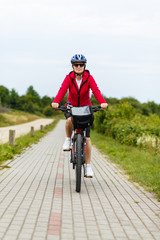 Fototapeta na wymiar Woman riding bike