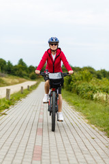 Naklejka premium Woman riding bike