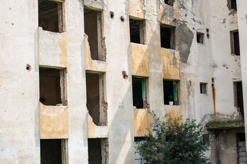 Old abandoned building block in a small industrial town in Romania.