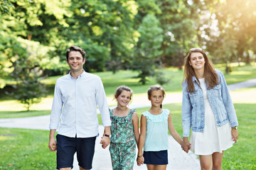 Young family with children having fun in nature