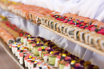Asian cuisine. Sushi, rolls and sashimi in restaurant