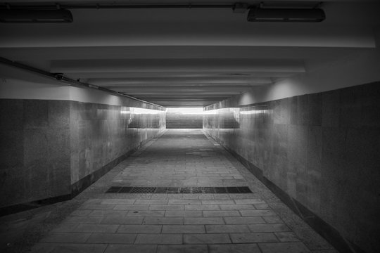 The underground passage lined with gray granite and marble
