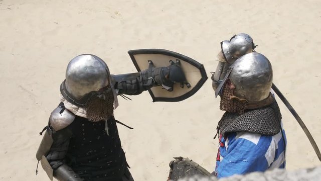 knights in a duel with swords and shields