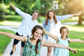 Young family with children having fun in nature
