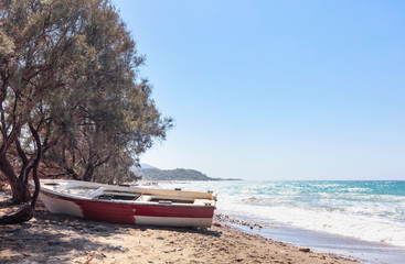 Old  fishing boat on a beach of the Mediterranean Sea.