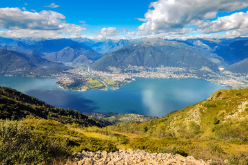 A look over the Lake Locarno (Ticino, Switzerland) on a summer day. The cities of Ascona and Locarno are lying next to the lake.