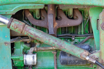 Obraz na płótnie Canvas Close up view of an old engine of a tractor