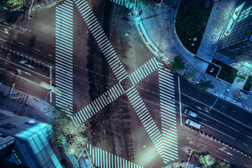 Aerial drone view on city intersection during night