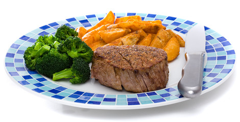 steak dinner on plate with sides