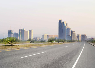 Fototapeta na wymiar Urban landscape road with city background