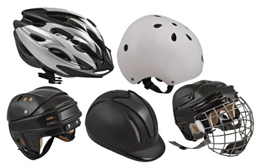 Football and cycling helmets on a white background
