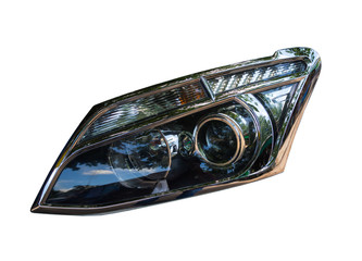 Closeup of car headlight on white background