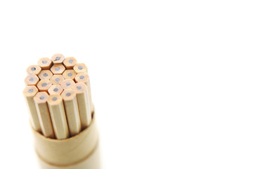 A couple of wooden pencils stacked together.