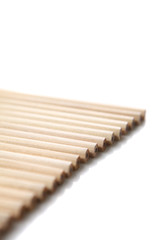A couple of wooden pencils stacked together.