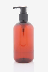 Brown liquid dispenser bottle isolated on white