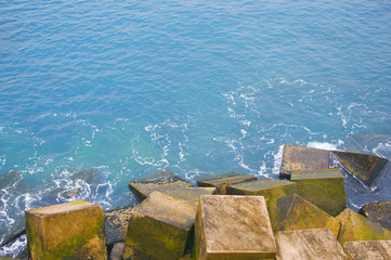 Blue ocean and cubic stones view, macro, summer