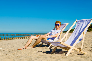 Young man relaxing on beach