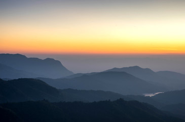 Fototapeta na wymiar Landscape nature beautiful sunrise on top of thailand mountain