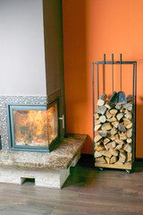 Fireplace with stack of firewoods