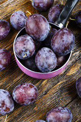 plums on a wooden background