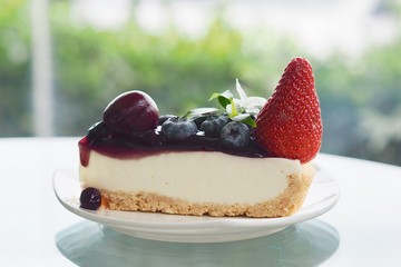 Eating mixed berries fruits cheese tart
