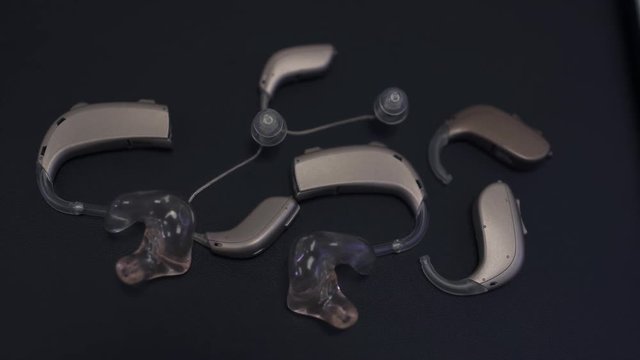 Several hearing aids on the table