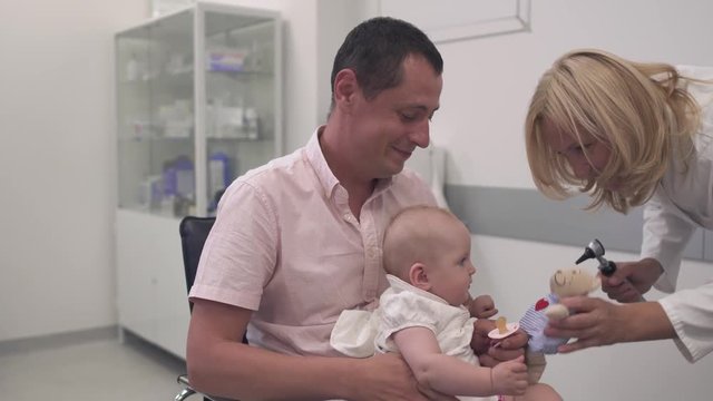 Nurse examines a baby