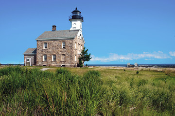 Fototapeta na wymiar Popular Stone Lighthouse on Island in Connecticut