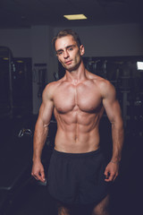 Fototapeta na wymiar Strong Athletic Man portrait - fitness trainer