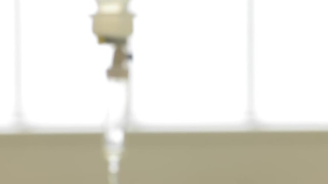  glucose drip is suspended over the hospital bed. Drip drop after drop. Panning camera, Pan, Closeup