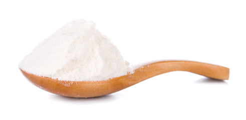 Fototapeta na wymiar Wheat flour in wooden spoon isolated on white background