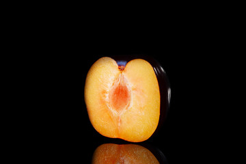 Sliced plum on a black background