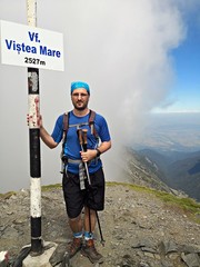 Climber portrait - man on the highest peek Vistea Mare Peek