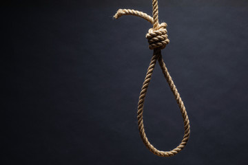 Noose. The concept of murder or suicide. On dark background