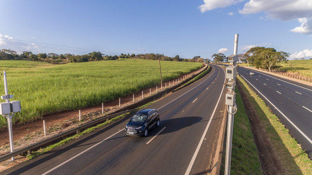 Traffic radar with speed enforcement camera in a highway. Automatic number plate recognition used for the detection of average speeds