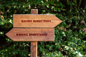 wooden sign indicating the direction