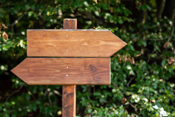 wooden sign indicating the direction