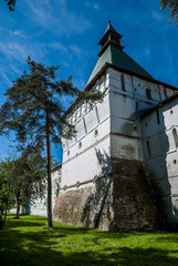 Old fortress tower on the sky background