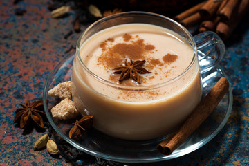 spicy masala tea on a dark background, closeup