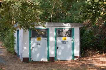 old transformer station edged of trees