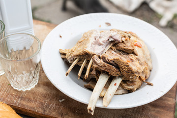 Boiled lamb in a plate on a wooden board