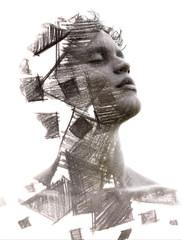 Paintography. Double Exposure charcoal drawing combined with portrait of a statuesque man with strong features and peaceful expression, black and whitePaintography. Double 