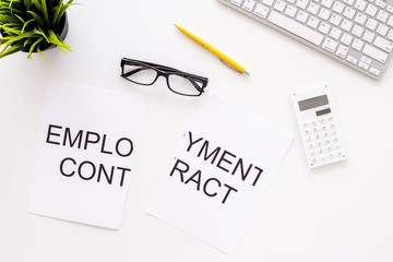 Break the contract concept. Torn sheet of paper with words Employment contract on office desk with computer keyboard on white background top view