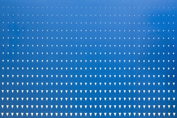 Abstract graphic design triangle halftone pattern on blue background