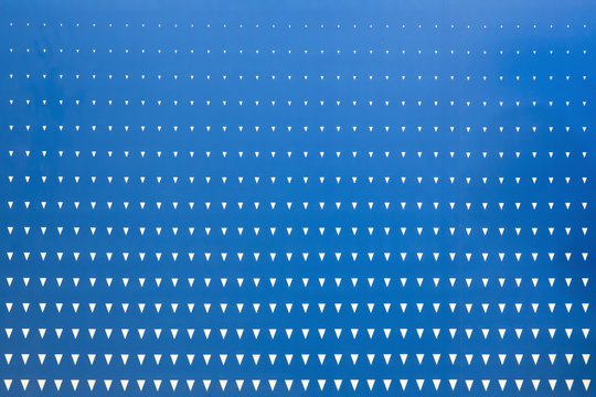 Abstract graphic design triangle halftone pattern on blue background